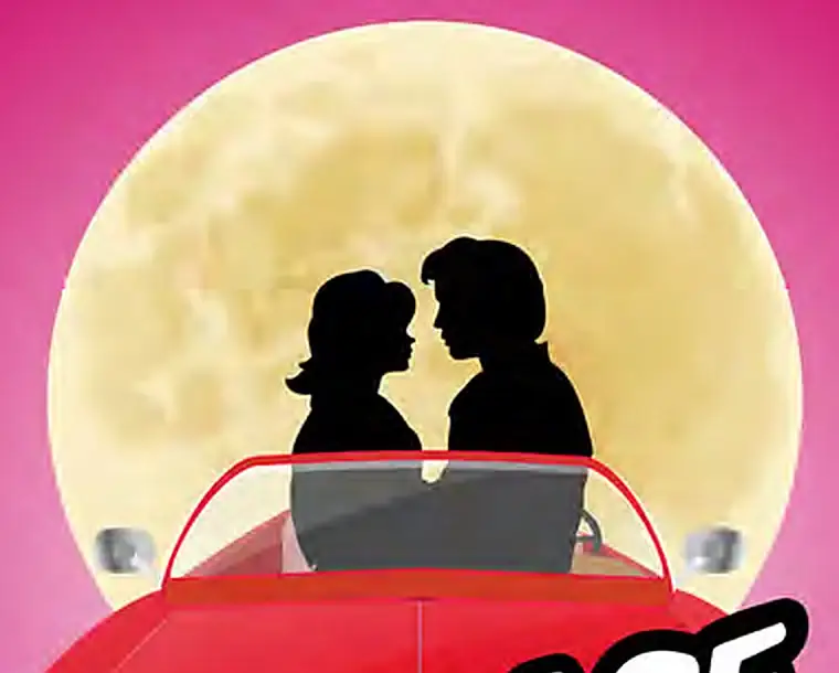 Close crop: the couple in silhouette against the moon